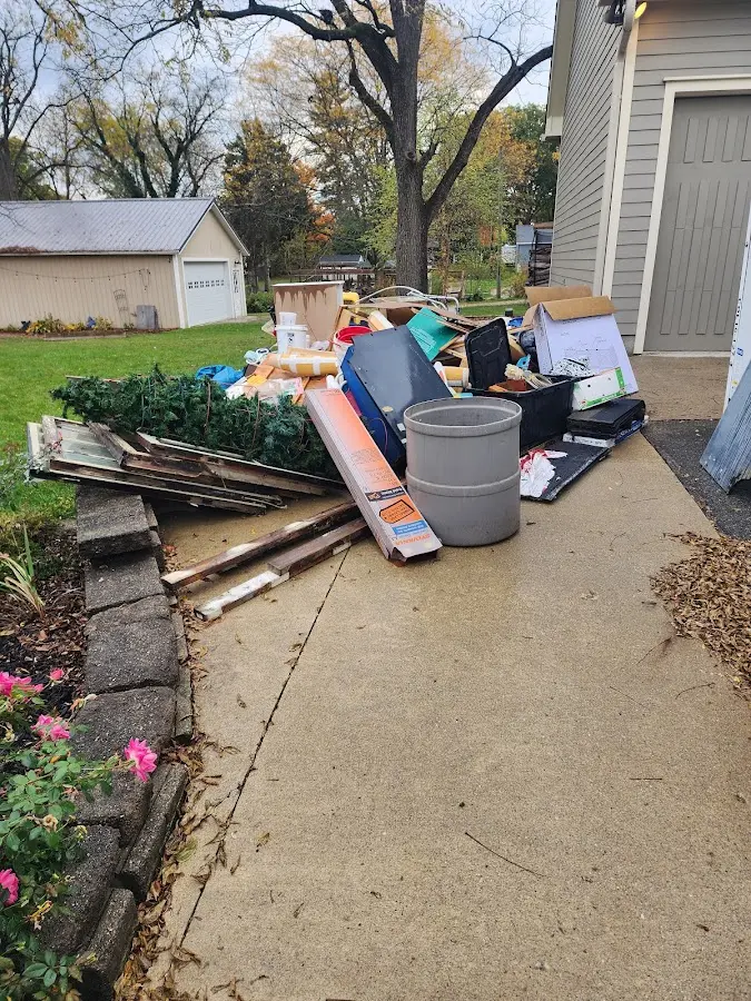 Dumpster being loaded with debris for 30 Yard Dumpster Rental in Etowah